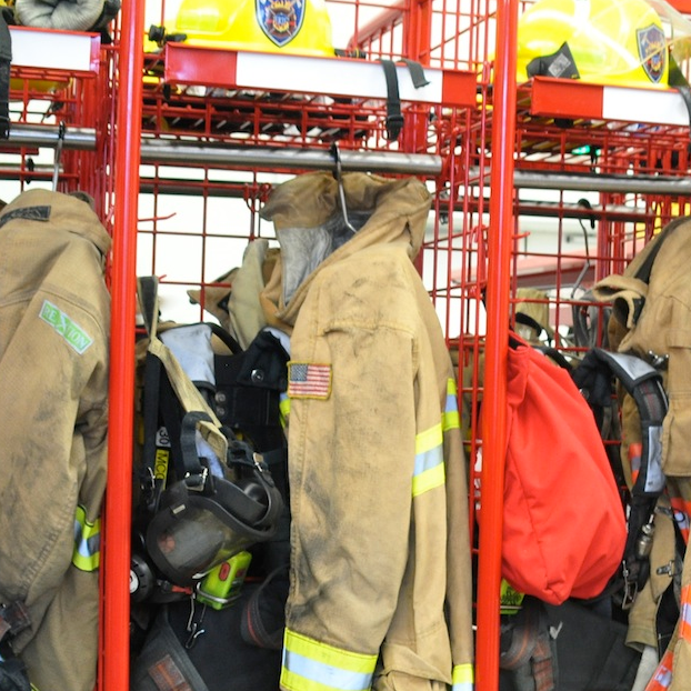 Firefighters equipment hung in locker.
