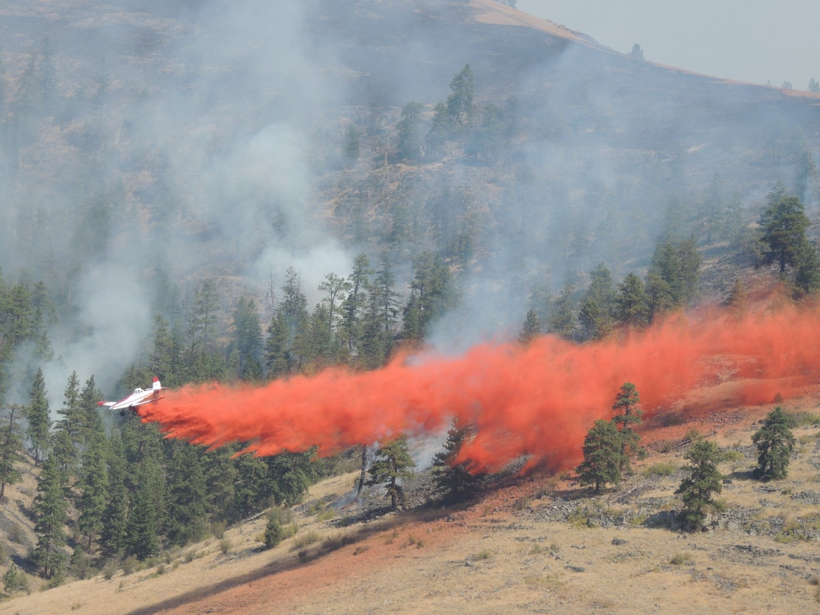 Airplane drops fire retardant on a 2012 fire in the Niobrara Valley