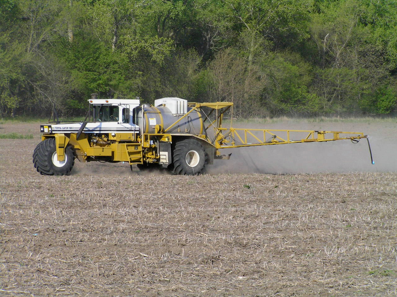 Ag machine sprays in field