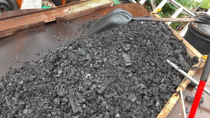 batch of biochar in barrel retort