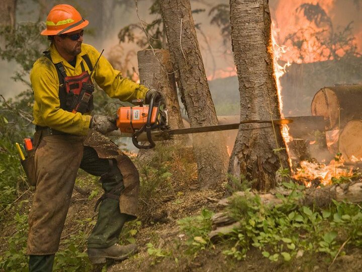 Photo of firefighter with chainsaw