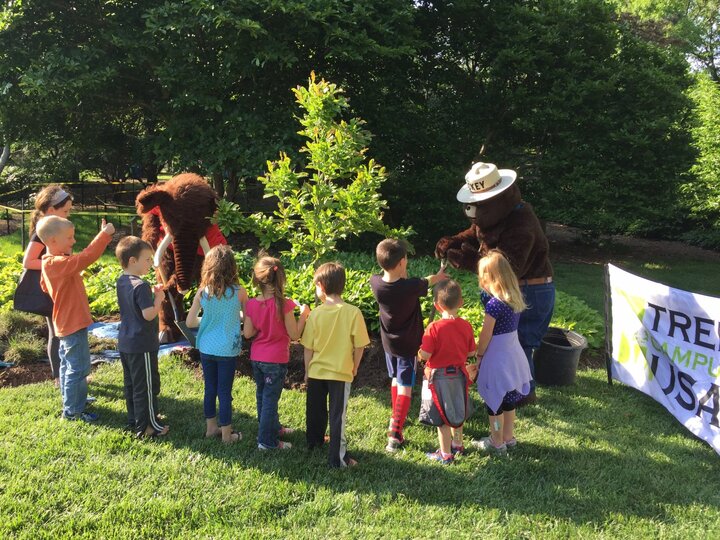 Smokey the Bear interacting with children.