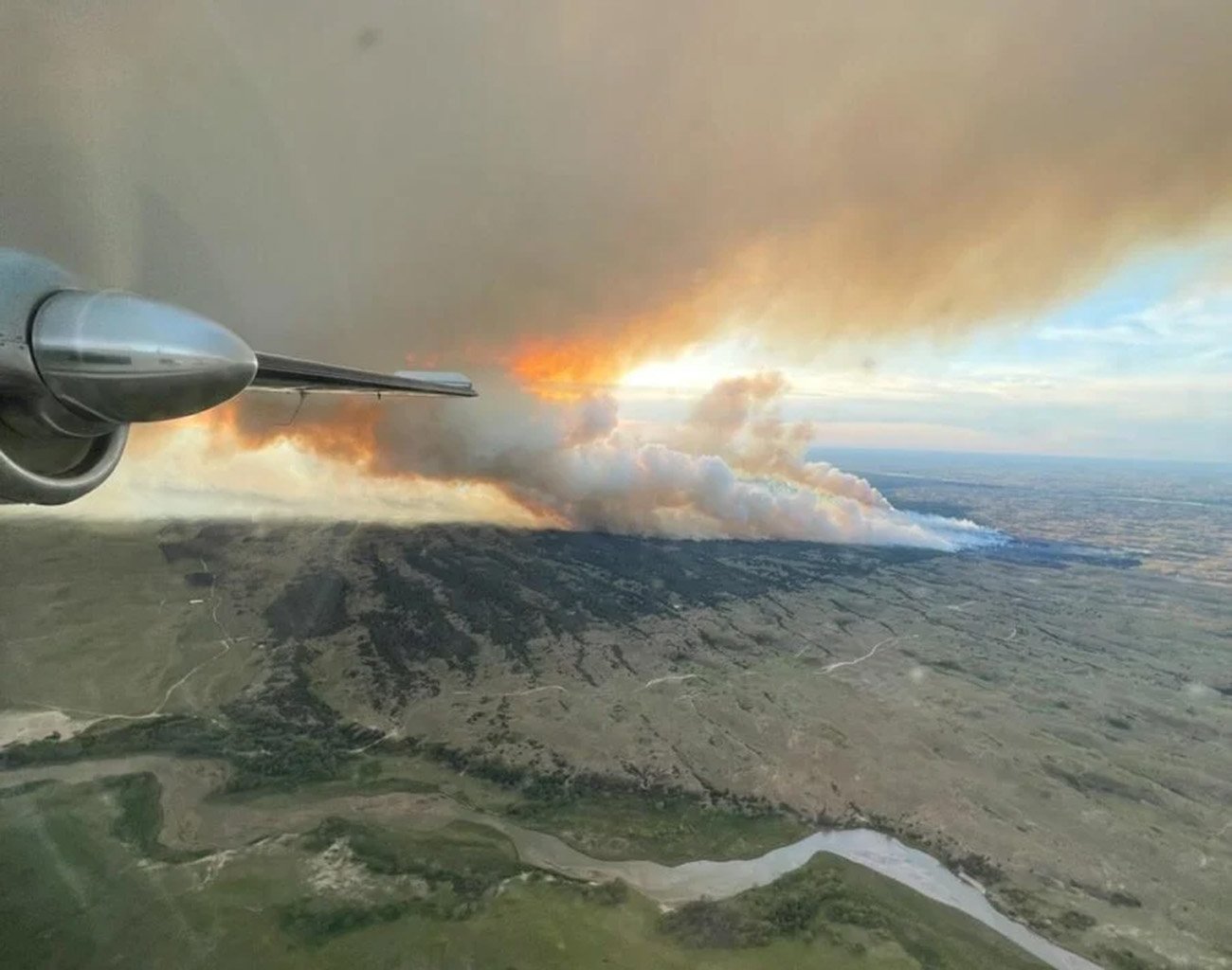 Aerial photo from airplane of a wild fire.