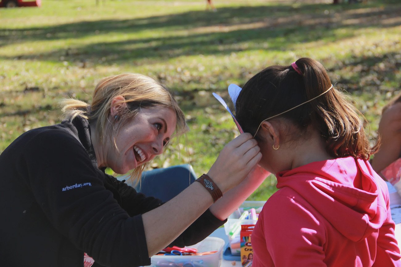 A child get their face painted at a NFS workshop.